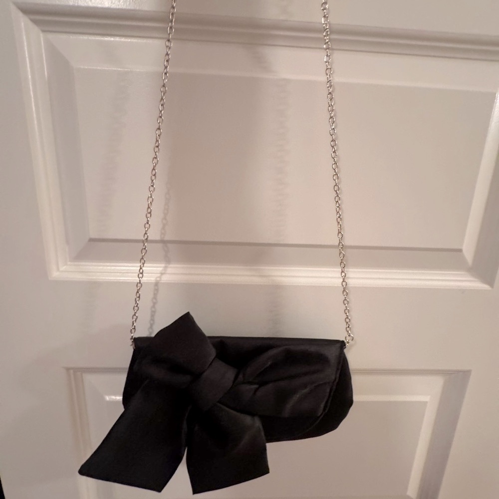 Landry Elegant Black Asymmetrical Bow Clutch (Dillard’s)